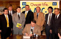 Governor Huckabee signs the Choose Life License Plate Bill