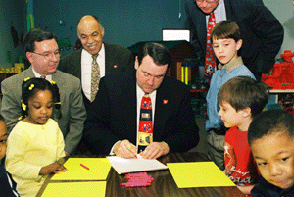 ARKids Bill Signed by Governor Huckabee